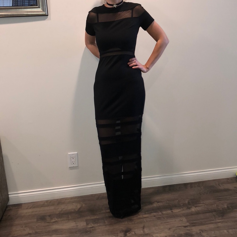 Black cocktail dress zipped in the back.